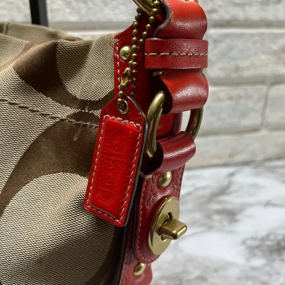 Coach Carly Signature Hobo Bag with red leather trim and gold-tone hardware. - Picture 2 of 14